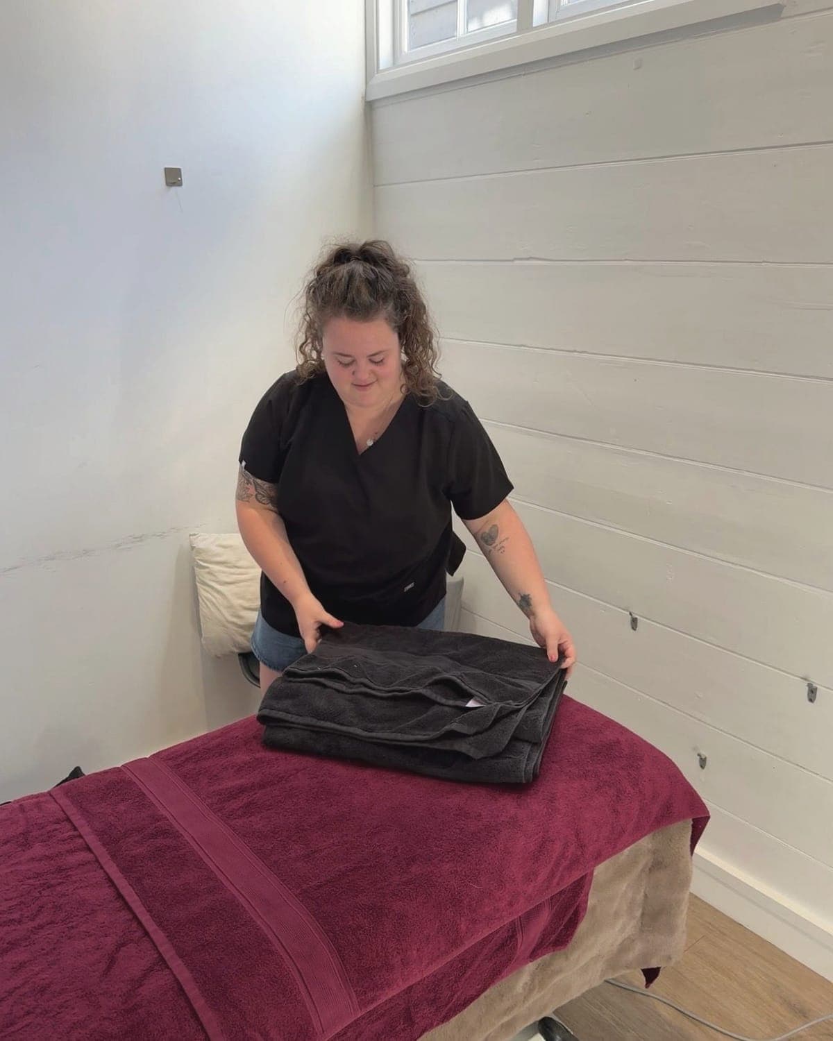 Lois preparing the treatment couch at Therapy & Fitness, West Malling